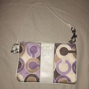 Purple and ivory Coach wristlet
